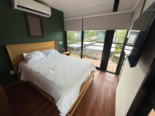 Giường trong phòng chung tại Residence Jardin de la Vida