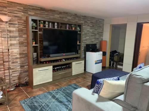 Un televizor și/sau centru de divertisment la Alojamiento Luisito