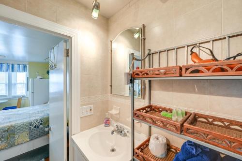 a bathroom with a sink and a mirror at Explore Boardwalk and Beaches! Ocean City Condo in Ocean City