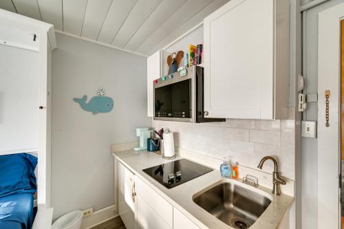 a small kitchen with a sink and a sink at Walk to Beach and Music Pier! Condo in Ocean City in Ocean City