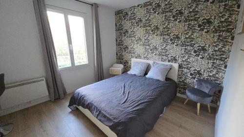 Ένα ή περισσότερα κρεβάτια σε δωμάτιο στο L'ALPETTE maison 3 pièces 2 chambres