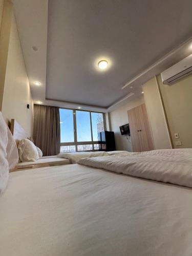 Cama o camas de una habitación en Anyma Pyramids View Inn