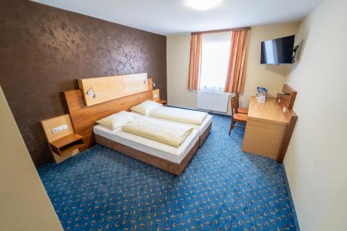 Voodi või voodid majutusasutuse Gasthof - Landhotel Ernst toas