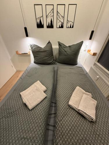 Ένα ή περισσότερα κρεβάτια σε δωμάτιο στο Goslar LIVING 3 - direkt am Weihnachtsmarkt