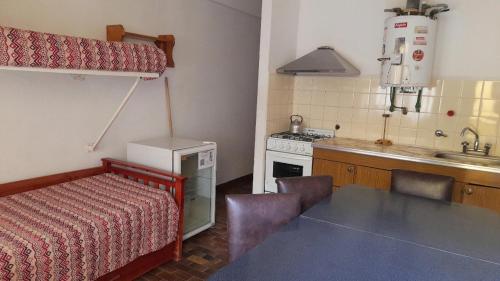 Postel nebo postele na pokoji v ubytování Complejo Las Toninas