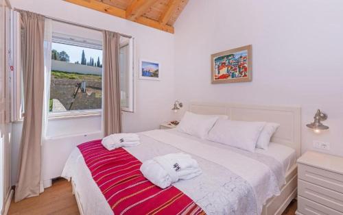 Giường trong phòng chung tại Villa Harmonia