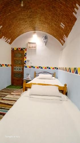 Ένα ή περισσότερα κρεβάτια σε δωμάτιο στο Nubian Dreams Heissa