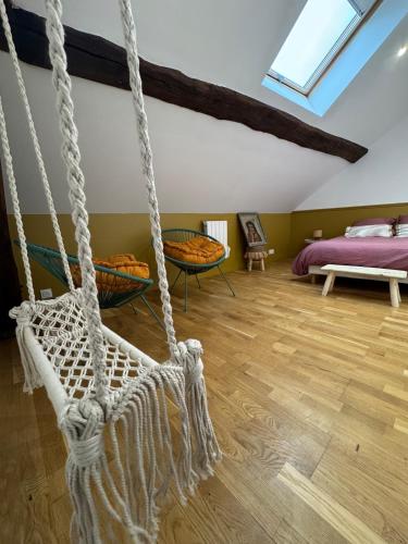 En eller flere senge i et værelse på Le 72 - Bohemian Chic - 20 min from Disneyland Paris