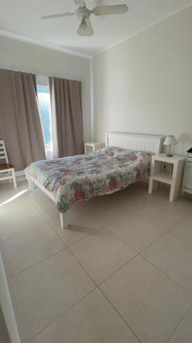 En eller flere senge i et værelse på Pammpa Pinamar