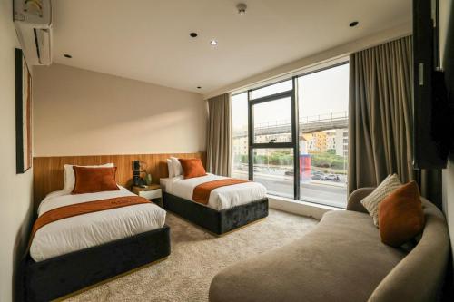 Voodi või voodid majutusasutuse Royal Regency Eg Hotel toas