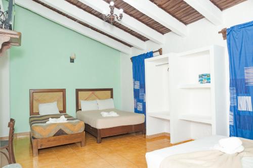 Ένα ή περισσότερα κρεβάτια σε δωμάτιο στο Hotel OM Tangolunda