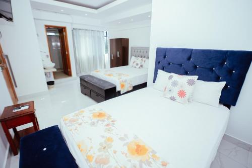 Un pat sau paturi într-o cameră la Hotel Cielo Tarapoto