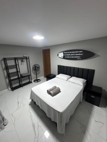 Ένα ή περισσότερα κρεβάτια σε δωμάτιο στο Pousada Praia Grande de Palmas