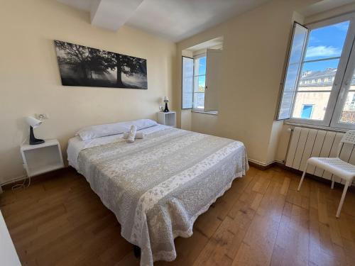 a bedroom with a bed with a teddy bear on it at SP 43 Vut in Lugo