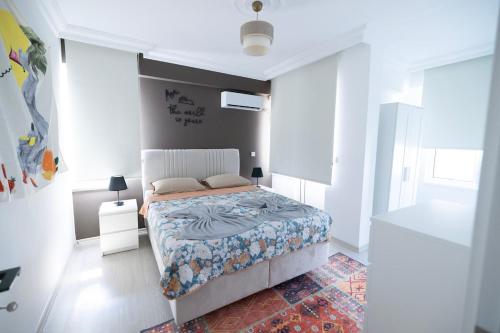 En eller flere senge i et værelse på Melissas Suites Lara