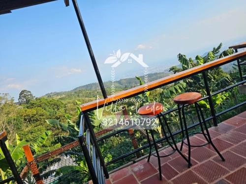 una vista desde el balcón de una casa en Glampin y Cabañas MAGISTRAL VILLA EL EDEN, en Cali