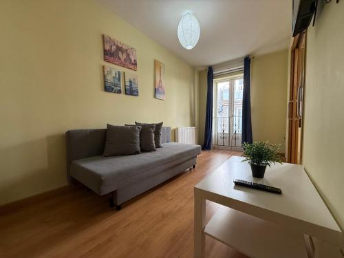 a living room with a couch and a table at SP 64 Vut in Lugo