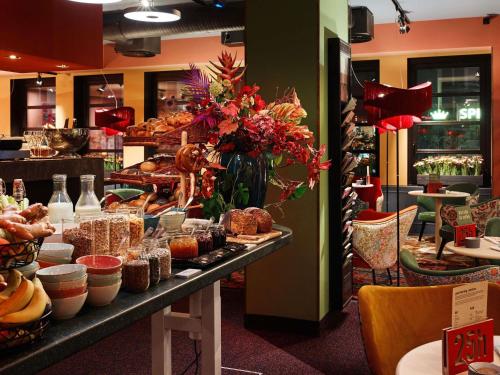 a bakery with a buffet of food on a table at 25hours Hotel The Goldman in Frankfurt/Main