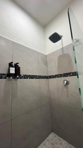 a shower in a bathroom with a shower head at Loft Guelaguetza B in Santa Cruz Huatulco