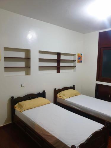 Postel nebo postele na pokoji v ubytování Appartement meublé Centre de Témara