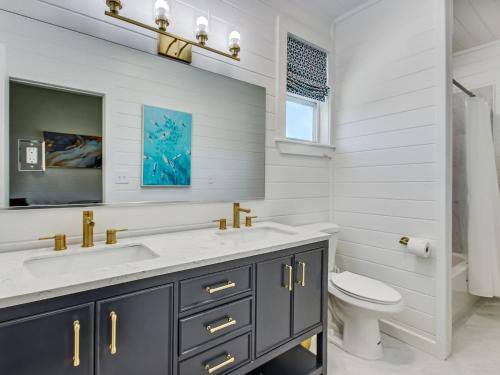 a bathroom with a sink and a toilet at Beachside Villa Unit 4 in Tybee Island