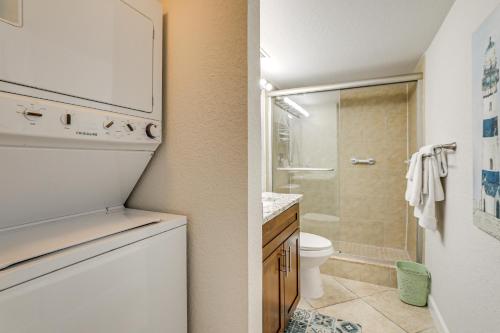 a small bathroom with a toilet and a shower at Bayfront South Pasadena Condo with Resort Perks in St Pete Beach