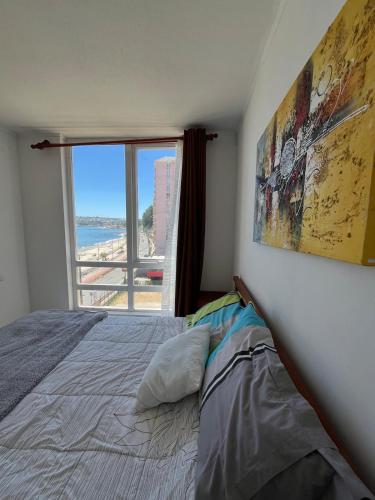 Ένα ή περισσότερα κρεβάτια σε δωμάτιο στο Gran departamento frente a la playa