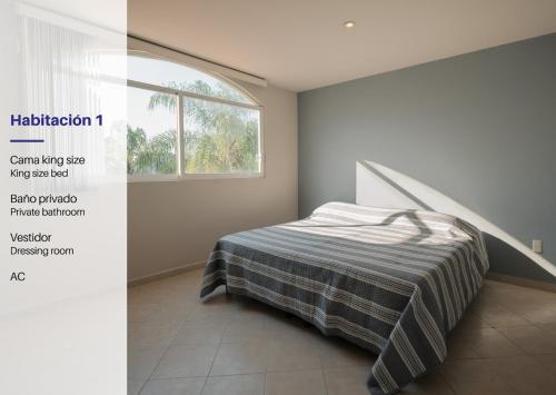 a bedroom with a bed and a window at Family House with Pool and Jacuzzi in Morelos in Chiconcuac