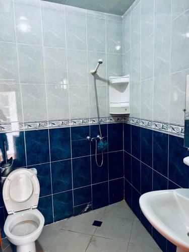a bathroom with a toilet and a sink at Surf Away Morocco in Agadir