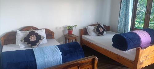 Voodi või voodid majutusasutuse Hamro Ghar Farmstay toas