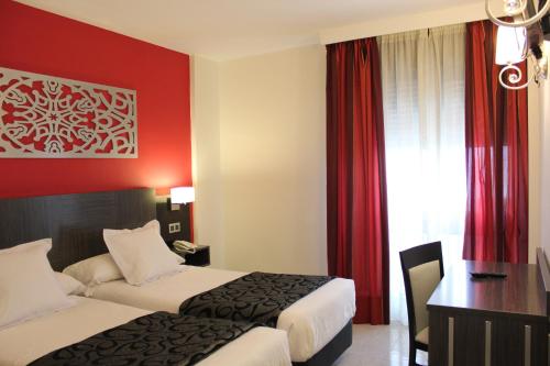 
Een bed of bedden in een kamer bij Hotel Venecia
