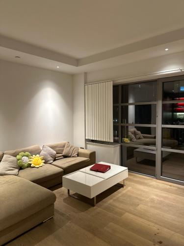 a living room with a couch and a coffee table at En-suite Room LUXURIOUS 2 bed Flatshare in London