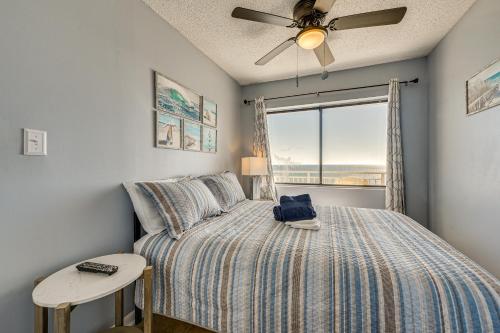 a bedroom with a bed and a window at Ocean-View Penthouse Condo in North Myrtle Beach! in Myrtle Beach