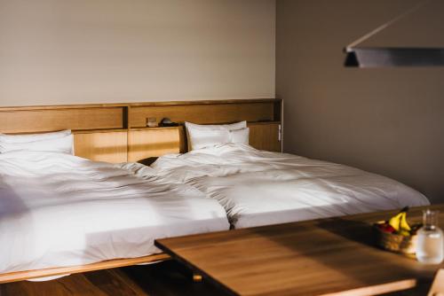 Ένα ή περισσότερα κρεβάτια σε δωμάτιο στο SANU 2nd Home Izu 1st