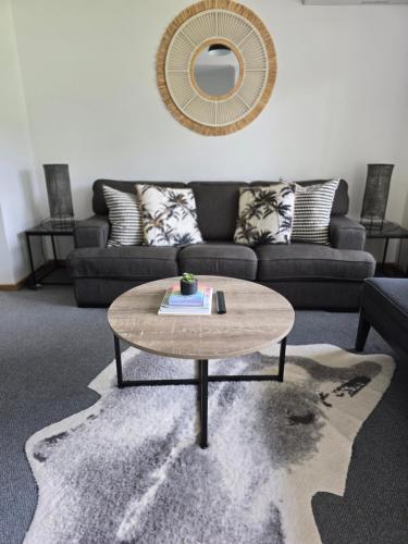 a living room with a coffee table and a couch at Parklands Cottage in Cowes