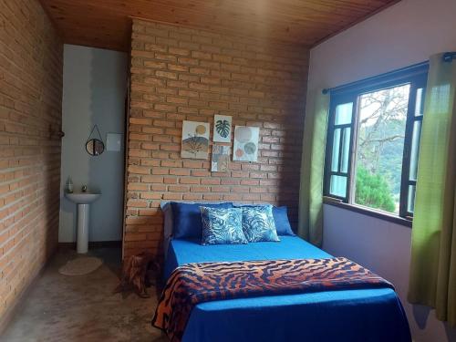 Giường trong phòng chung tại São João da Colina Ranch itamonte MG