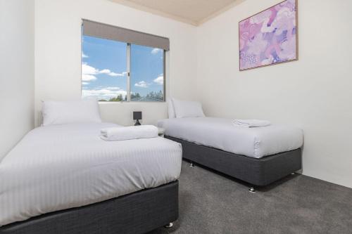 Ένα ή περισσότερα κρεβάτια σε δωμάτιο στο Anchorage 33