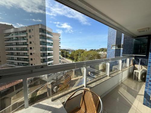 a balcony with a view of a building at Apartamento com vista da Baía do Pontal in Ilhéus