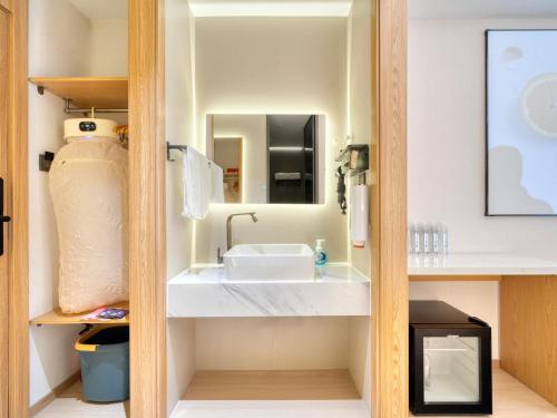 Et badeværelse på The Screen Hotel Hangzhou East St ation-Zhanongkou Metro