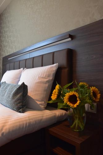 Postel nebo postele na pokoji v ubytování OZO Hotels Armada Amsterdam