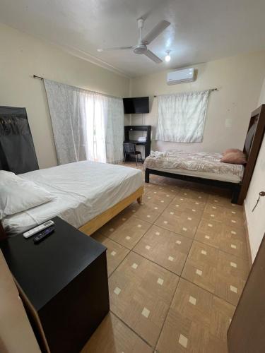 Кровать или кровати в номере confortable casa de 3 habitaciones con aire acondicionado