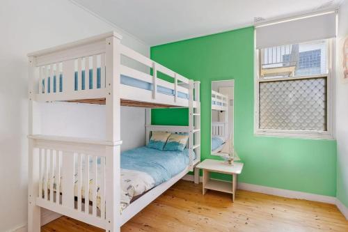 Una cama o camas en una habitación de Oceanfront Stay - Steps to the Sand