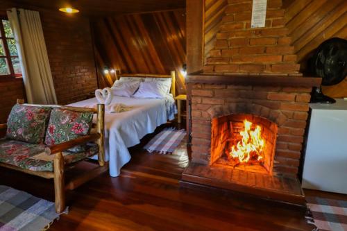 Voodi või voodid majutusasutuse Pousada Das Araucárias toas