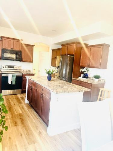 a kitchen with wooden cabinets and a counter top at Yedengel in DEN