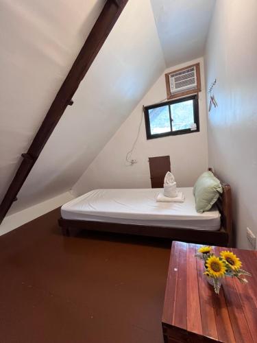 Ένα ή περισσότερα κρεβάτια σε δωμάτιο στο Bangka Hostels