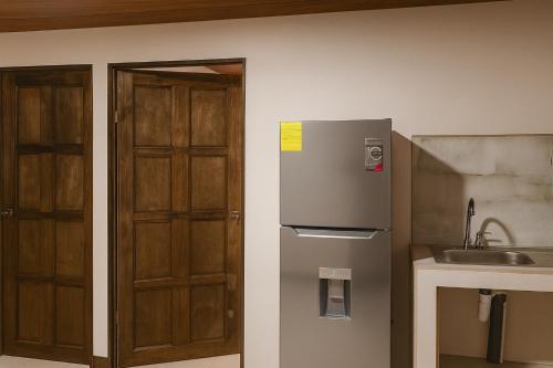 Kuchyň nebo kuchyňský kout v ubytování KEYTRI Rooms