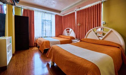 Llit o llits en una habitació de Hotel Señorial