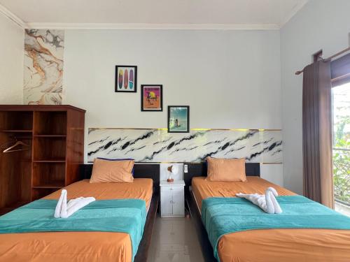 Ένα ή περισσότερα κρεβάτια σε δωμάτιο στο Medewi Hady Surf Camp