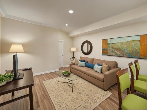 a living room with a couch and a table at Modern Luxury Apartments in the Heart of Los Angeles in Los Angeles