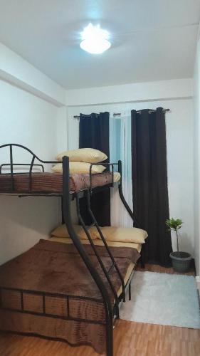 Ένα ή περισσότερα κρεβάτια σε δωμάτιο στο Degay Transient House